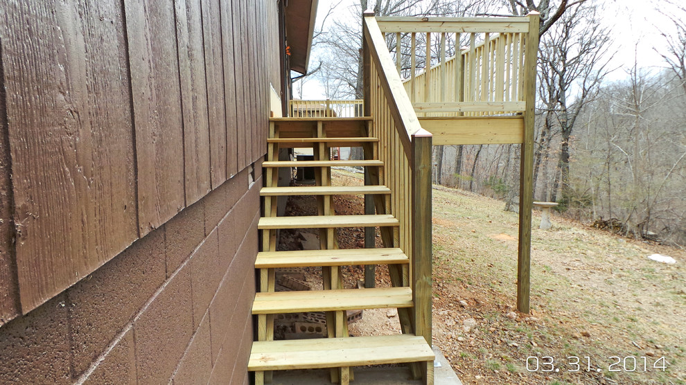 Inspiration for a mid-sized backyard deck remodel with decking and no cover