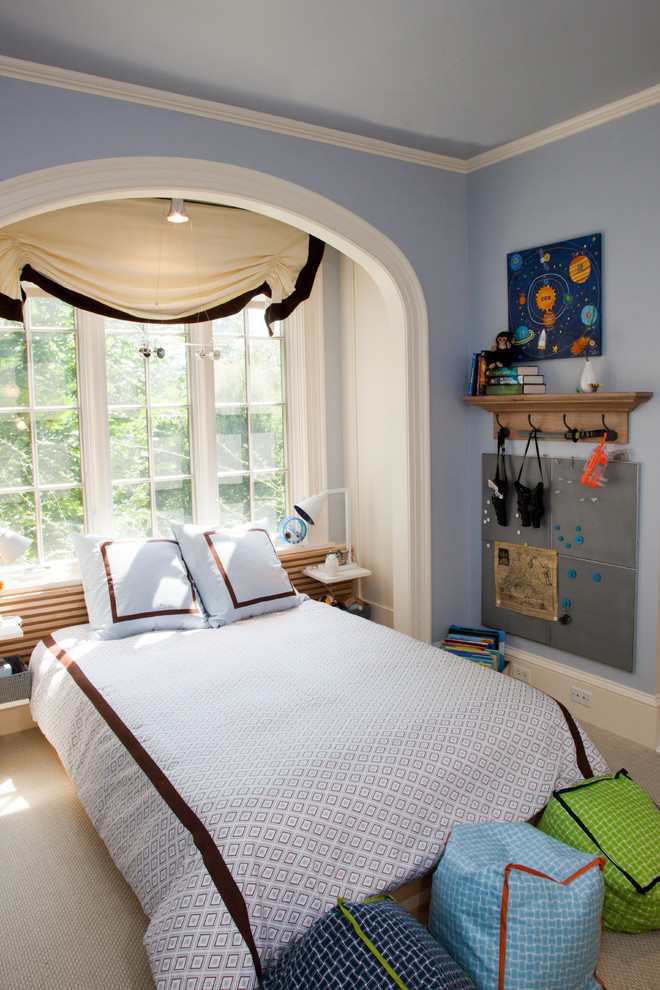 This is an example of a mid-sized contemporary kids' bedroom for kids 4-10 years old and boys in DC Metro with blue walls, carpet and beige floor.