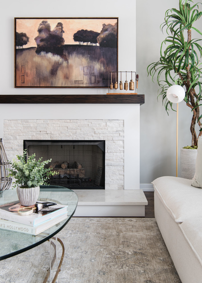 Inspiration for a small timeless open concept living room remodel in Chicago with white walls, a standard fireplace and a stone fireplace