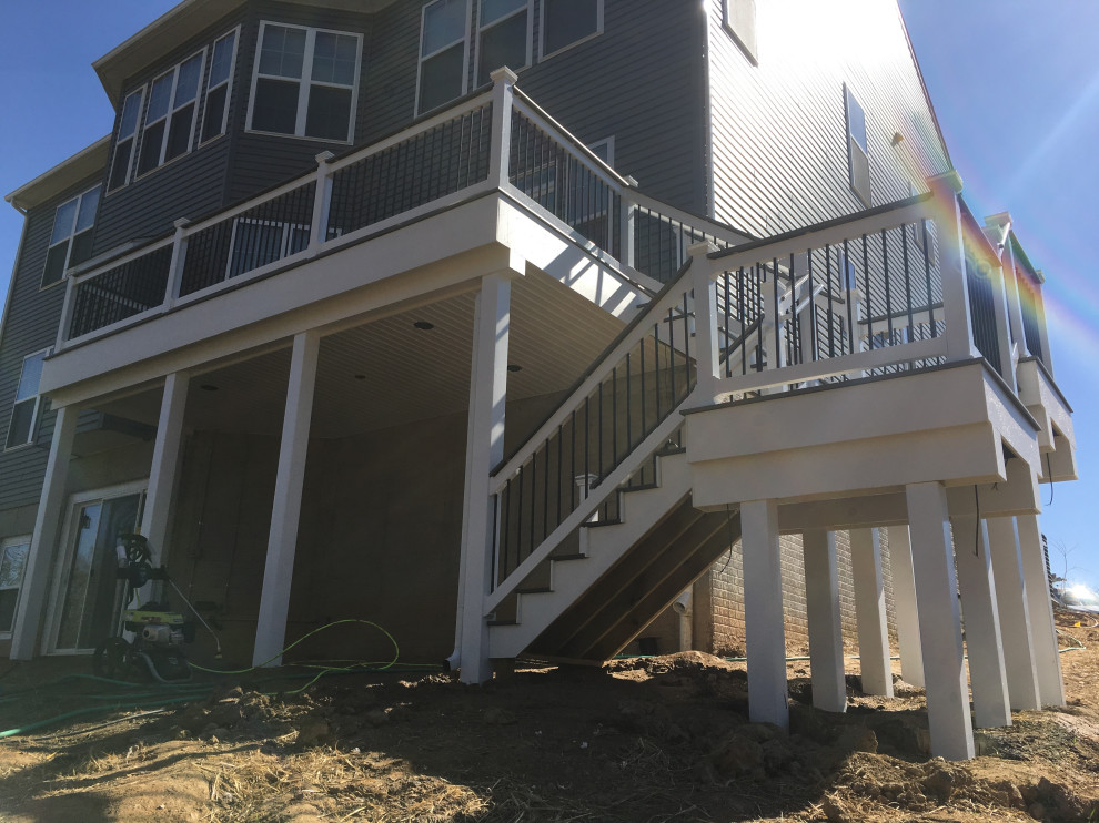 Example of a mid-sized backyard second story deck design in Baltimore with no cover