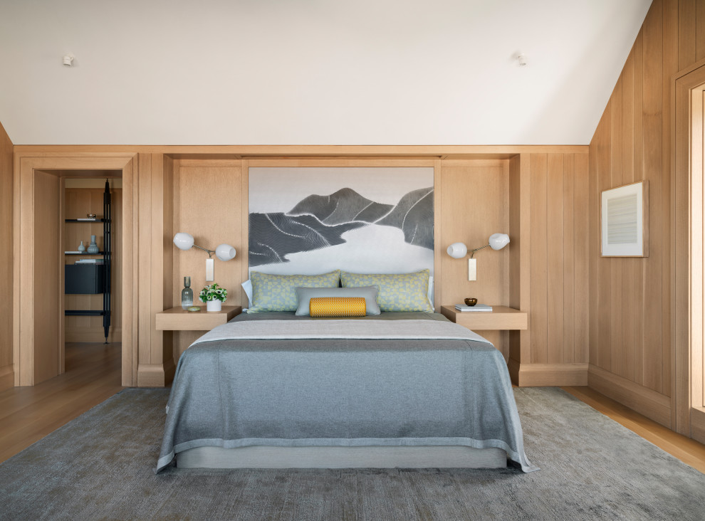 Design ideas for a nautical master bedroom in San Francisco with brown walls, medium hardwood flooring, no fireplace, brown floors and wood walls.
