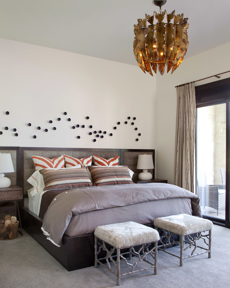 Inspiration for a contemporary bedroom in Denver with white walls and carpet.