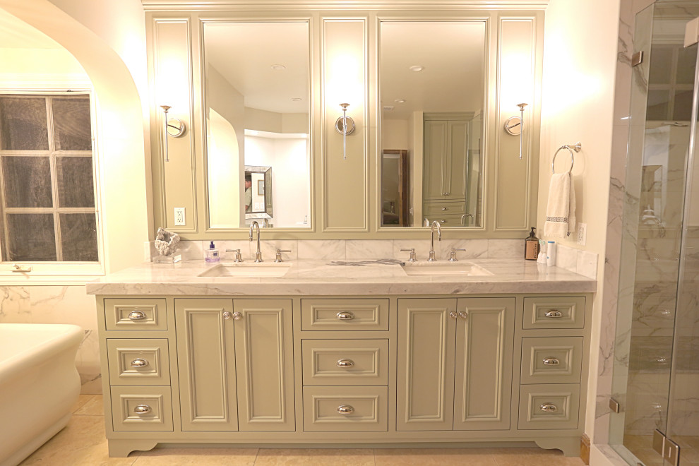 Bathroom - huge 1950s master white tile and marble tile ceramic tile, beige floor and double-sink bathroom idea in Orange County with recessed-panel cabinets, green cabinets, a one-piece toilet, yellow walls, a console sink, quartzite countertops, a hinged shower door, white countertops and a built-in vanity