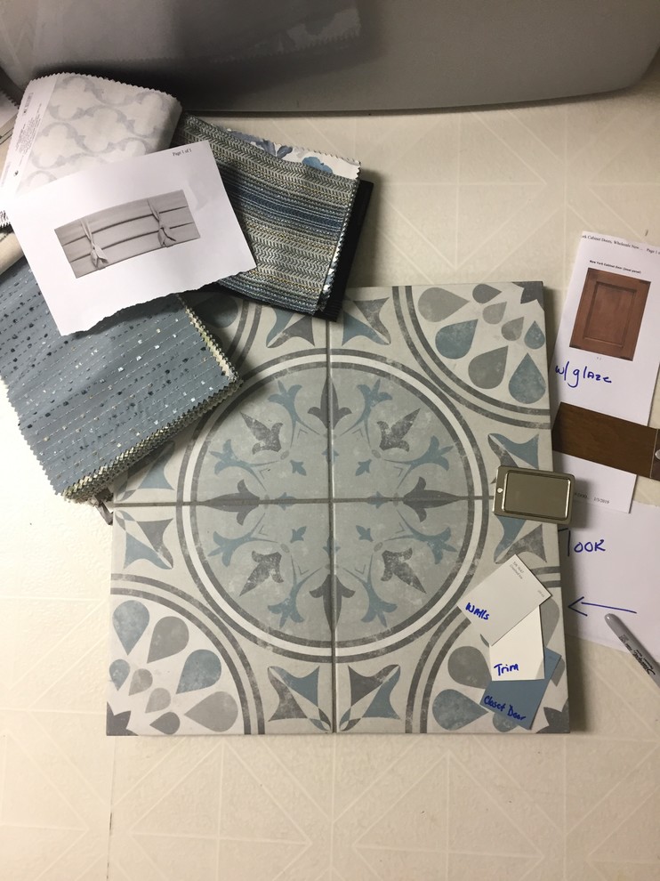 Inspiration for a transitional porcelain tile laundry room remodel with quartzite countertops, white walls, a side-by-side washer/dryer and white countertops