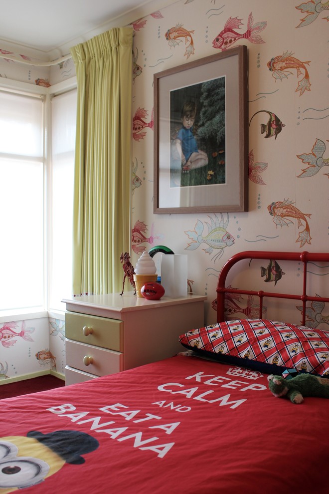 This is an example of a mid-sized eclectic gender-neutral kids' bedroom for kids 4-10 years old in Melbourne with multi-coloured walls, carpet and red floor.