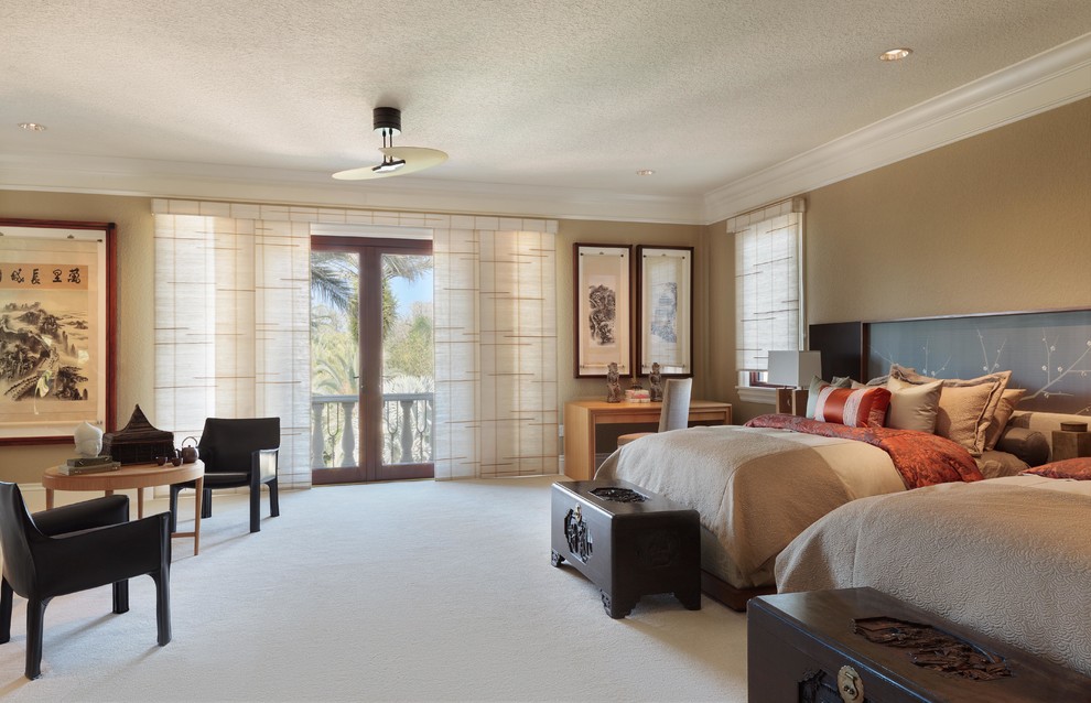 Expansive asian guest bedroom in Tampa with brown walls, carpet and no fireplace.