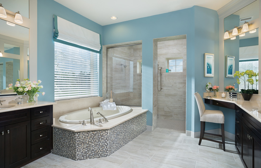 Large bathroom in Tampa with an undermount sink, recessed-panel cabinets, dark wood cabinets, granite benchtops, a drop-in tub, a bidet, beige tile, ceramic tile, blue walls, ceramic floors and with a sauna.