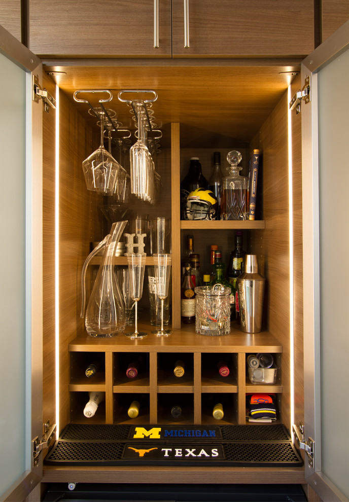 This is an example of a modern home bar in Other.