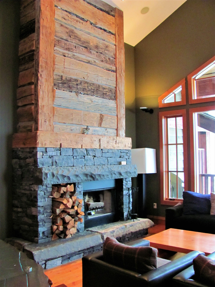 Living room - mid-sized rustic formal medium tone wood floor living room idea with green walls, a ribbon fireplace and a stone fireplace