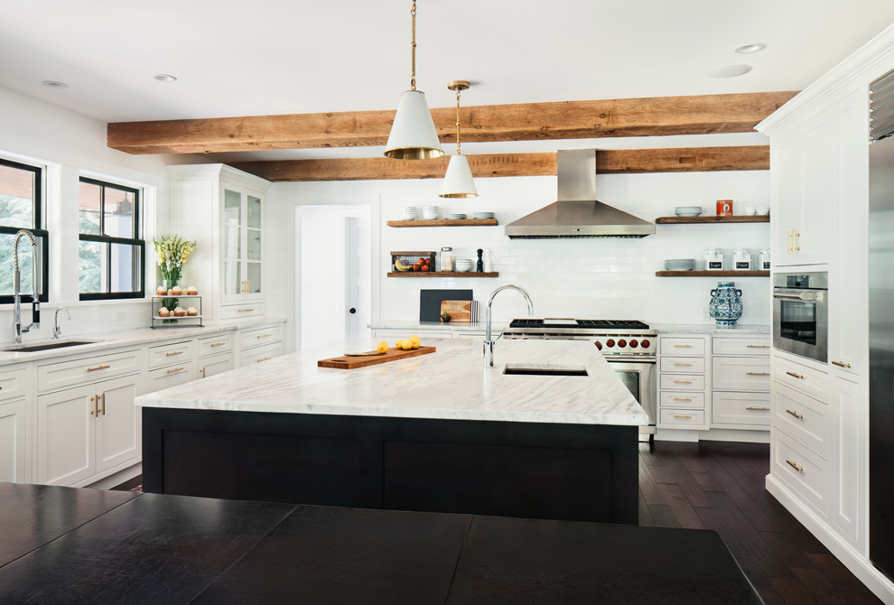 Inspiration for a large country eat-in kitchen in New York with a drop-in sink, white cabinets, marble benchtops, white splashback, subway tile splashback, stainless steel appliances, dark hardwood floors and with island.
