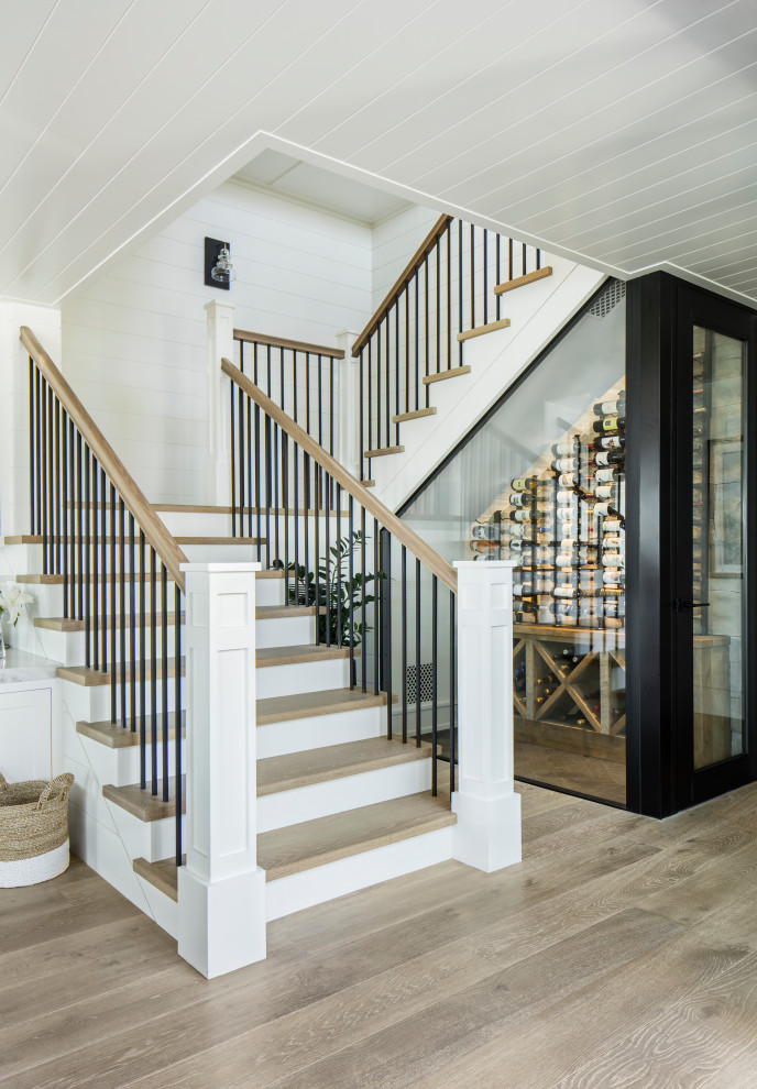 This is an example of a beach style wood staircase in Orange County.