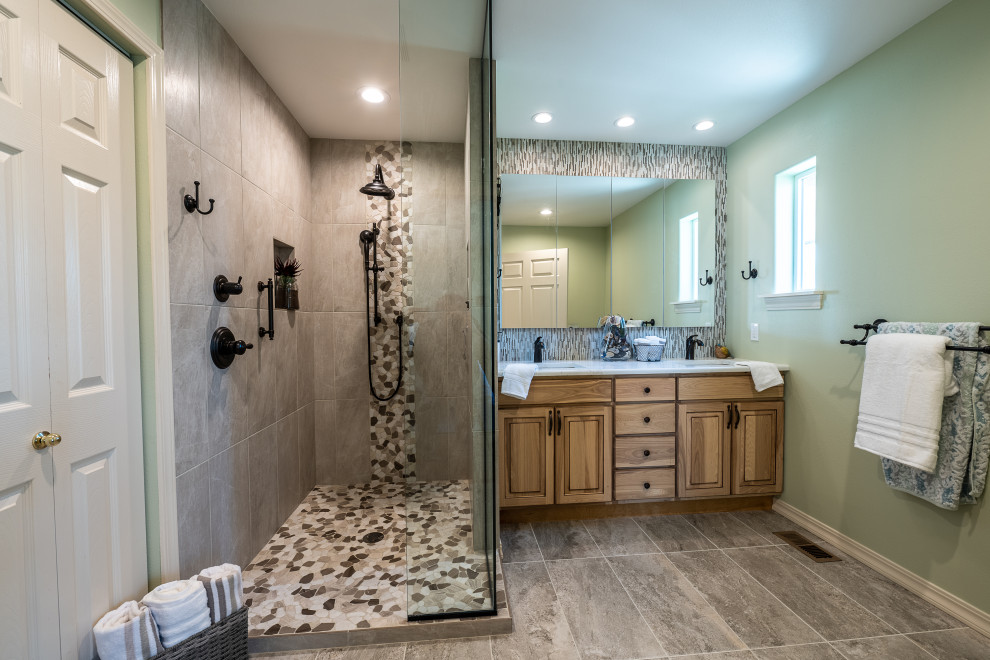 Design ideas for a mid-sized transitional master bathroom in Other with a curbless shower, a one-piece toilet, gray tile, pebble tile, green walls, ceramic floors, an undermount sink, quartzite benchtops, multi-coloured floor, an open shower, white benchtops and a built-in vanity.