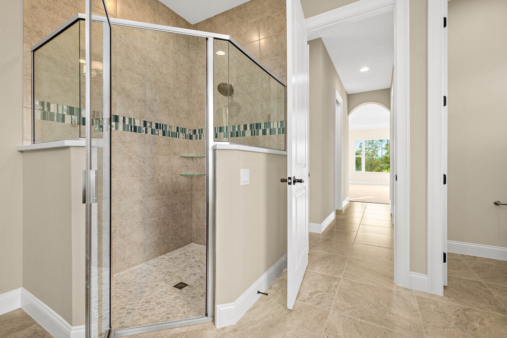 Photo of a large transitional master bathroom in Orlando with recessed-panel cabinets, dark wood cabinets, a corner tub, an alcove shower, a one-piece toilet, beige tile, ceramic tile, beige walls, ceramic floors, a wall-mount sink, engineered quartz benchtops, beige floor, a hinged shower door, white benchtops, a shower seat, a double vanity and a built-in vanity.