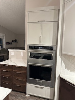 Double oven with micro added with adjacent 8-drawer cabinet