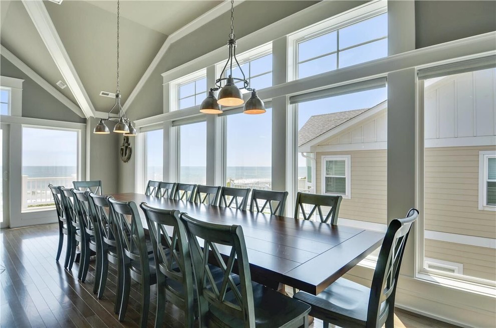Mid-sized beach style open plan dining in Other with grey walls, dark hardwood floors and no fireplace.