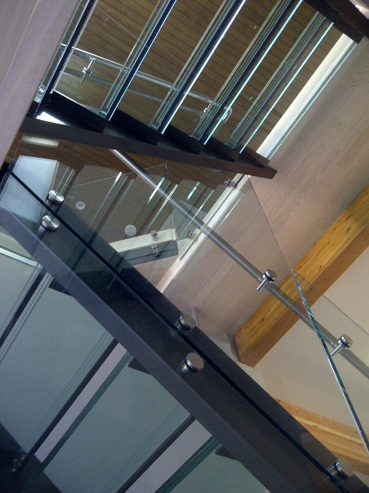 Example of a mid-sized trendy home design design in Vancouver