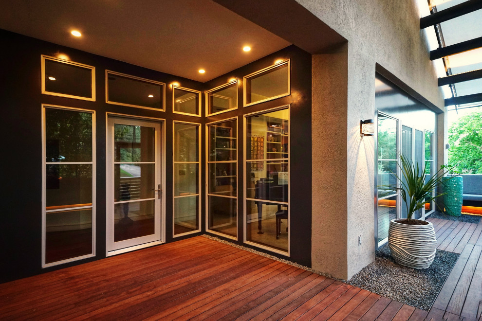 Mid-sized modern front door in Austin with grey walls, dark hardwood floors, a single front door, a white front door, brown floor, coffered and panelled walls.