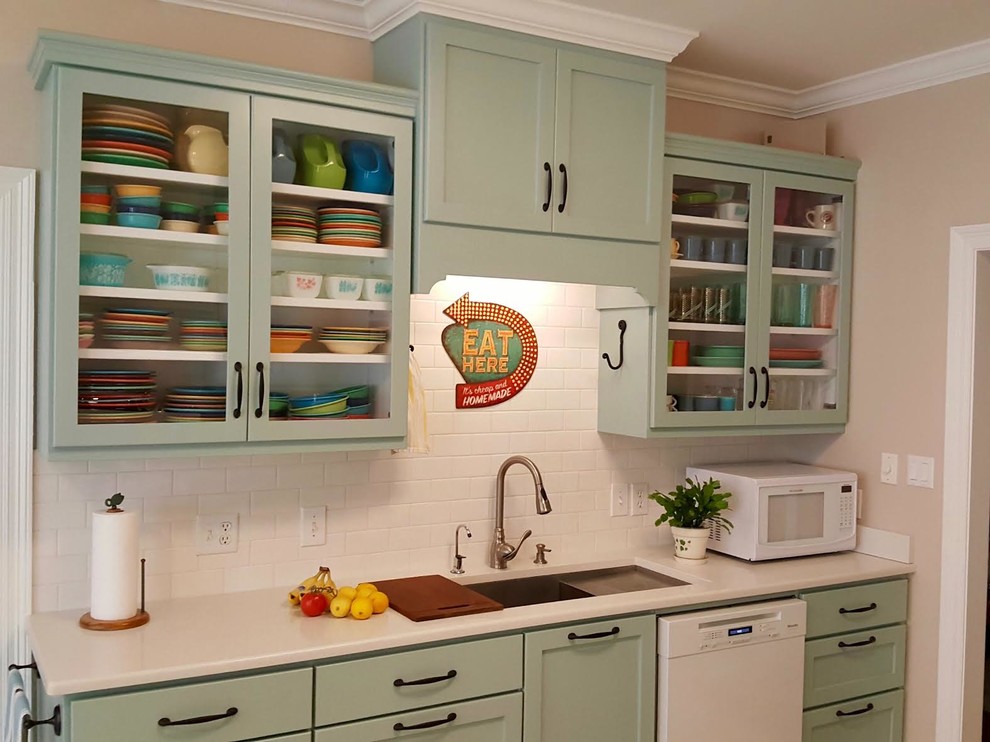 Design ideas for a mid-sized midcentury eat-in kitchen in Miami with an undermount sink, shaker cabinets, blue cabinets, quartzite benchtops, white splashback, subway tile splashback, white appliances, ceramic floors, a peninsula and beige floor.