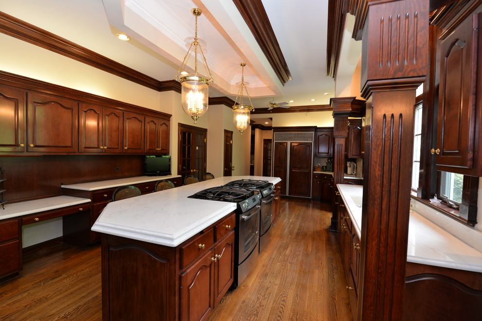 Example of a mid-sized transitional medium tone wood floor open concept kitchen design in Chicago with an integrated sink, beaded inset cabinets, dark wood cabinets, quartz countertops and an island