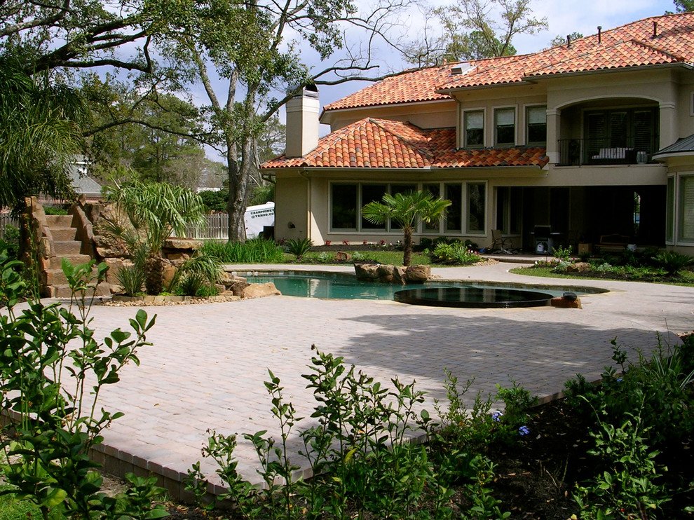 Inspiration for a beach style backyard partial sun garden for summer in Houston.