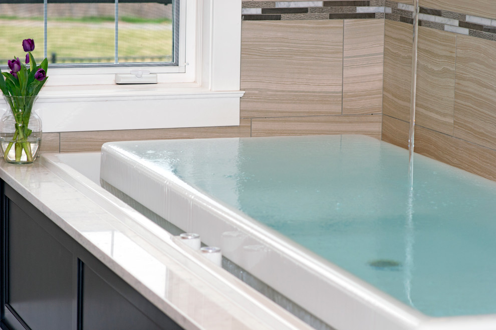Large transitional beige tile and porcelain tile porcelain tile sauna photo in Seattle with an undermount sink, shaker cabinets, gray cabinets, quartz countertops, an undermount tub, a bidet and gray walls