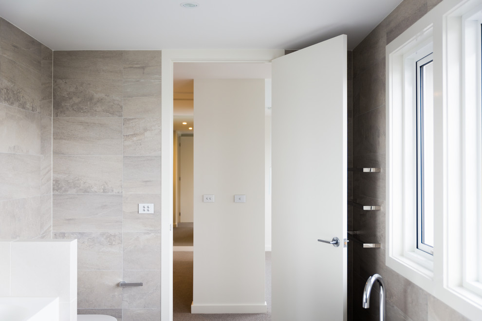 Design ideas for a modern bathroom in Sydney with gray tile.