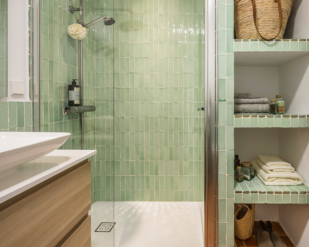 This is an example of a small mediterranean bathroom in Valencia with green tiles, terracotta tiles, white walls, terracotta flooring, a built-in sink, engineered stone worktops, brown floors, light wood cabinets, white worktops and a floating vanity unit.