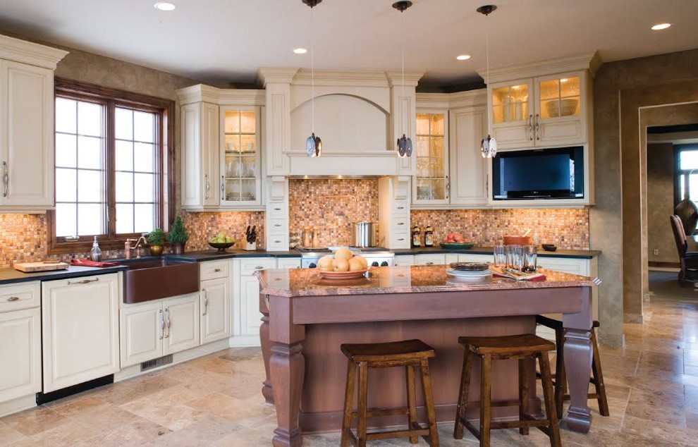 Inspiration for a mid-sized transitional l-shaped eat-in kitchen remodel in Omaha with a farmhouse sink, raised-panel cabinets, white cabinets, beige backsplash, stainless steel appliances and an island