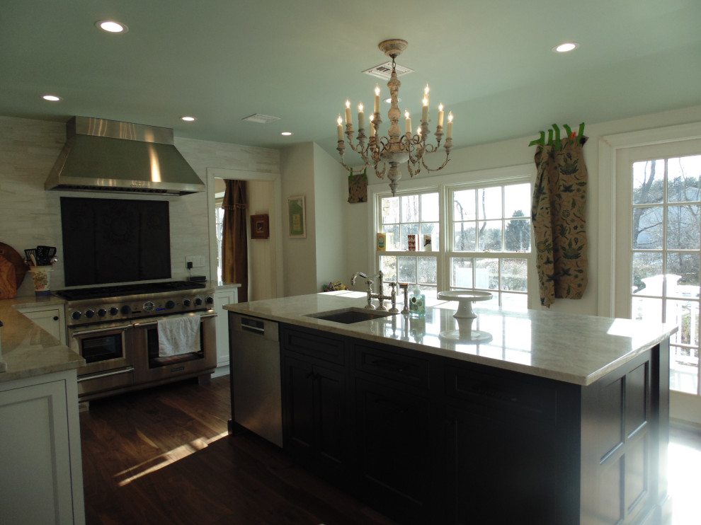 Inspiration for a large transitional u-shaped medium tone wood floor and brown floor eat-in kitchen remodel with an undermount sink, recessed-panel cabinets, white cabinets, quartzite countertops, beige backsplash, subway tile backsplash, stainless steel appliances, an island and beige countertops