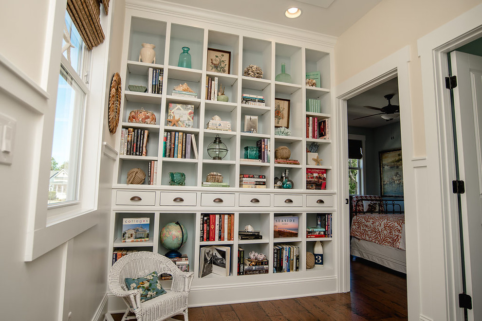 Photo of a mid-sized arts and crafts hallway in Other with white walls and medium hardwood floors.