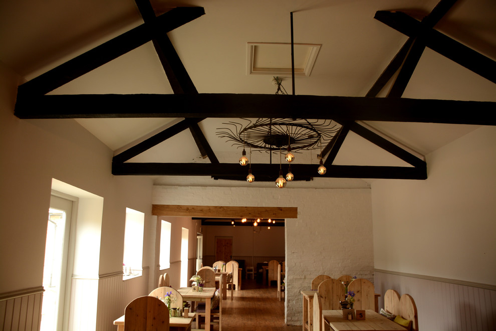 Design ideas for a traditional dining room in Cambridgeshire.