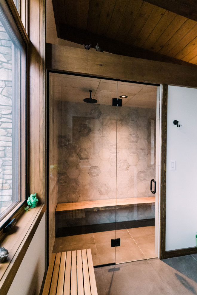 Large master bathroom in Other with gray tile, white walls, medium hardwood floors, a vessel sink, wood benchtops, brown floor, a hinged shower door, brown benchtops, a shower seat, a double vanity, a floating vanity, exposed beam, flat-panel cabinets and light wood cabinets.