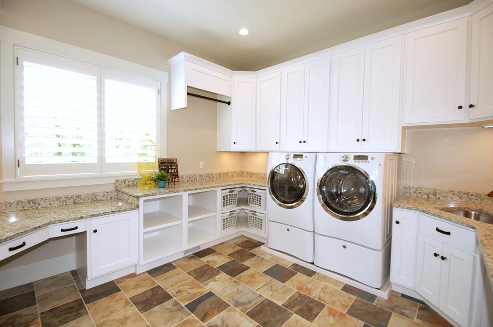 Design ideas for a large arts and crafts u-shaped utility room in Salt Lake City with an undermount sink, shaker cabinets, white cabinets, granite benchtops, beige walls and a side-by-side washer and dryer.