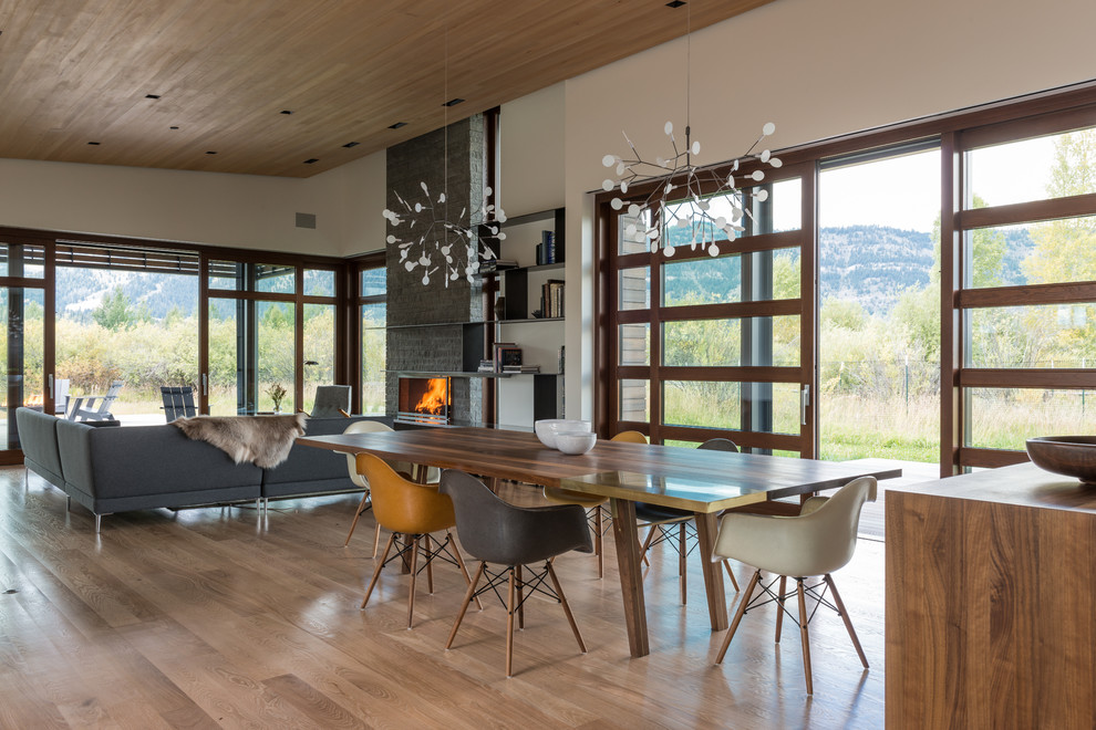 This is an example of a contemporary open plan dining in Salt Lake City with white walls and medium hardwood floors.