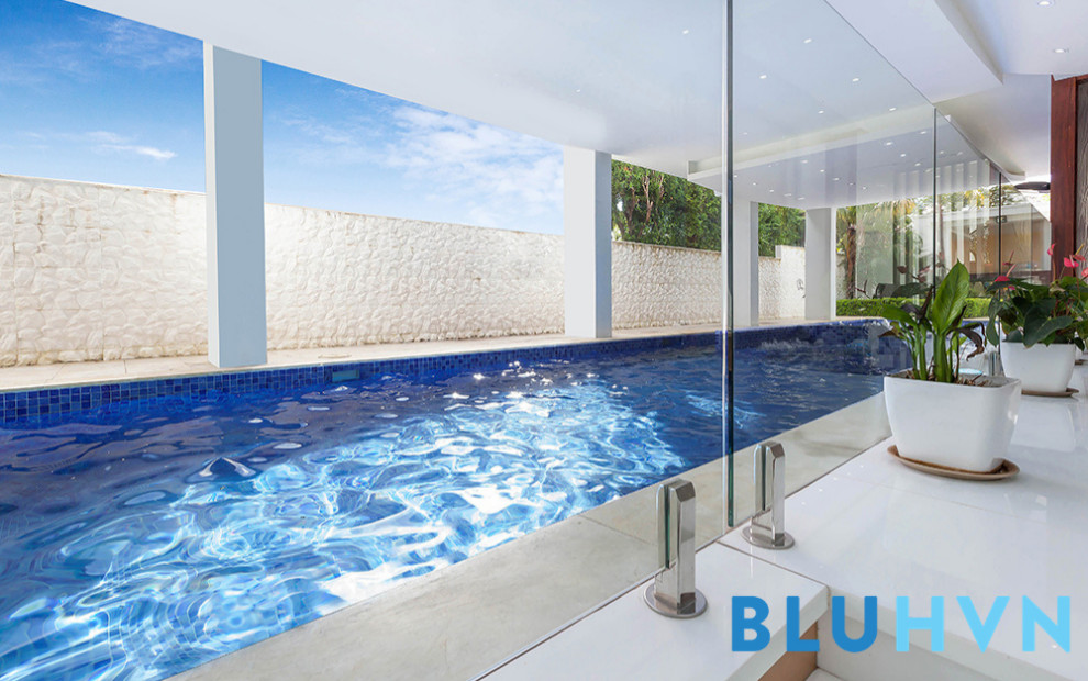 This is an example of an indoor rectangular pool in Sydney with a hot tub.