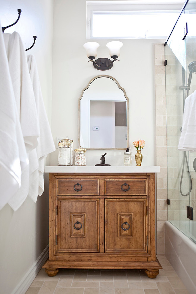 Inspiration for a small mediterranean master bathroom in San Diego with medium wood cabinets, a corner shower, beige tile, stone tile, white walls, travertine floors, an undermount sink, engineered quartz benchtops, an alcove tub and recessed-panel cabinets.