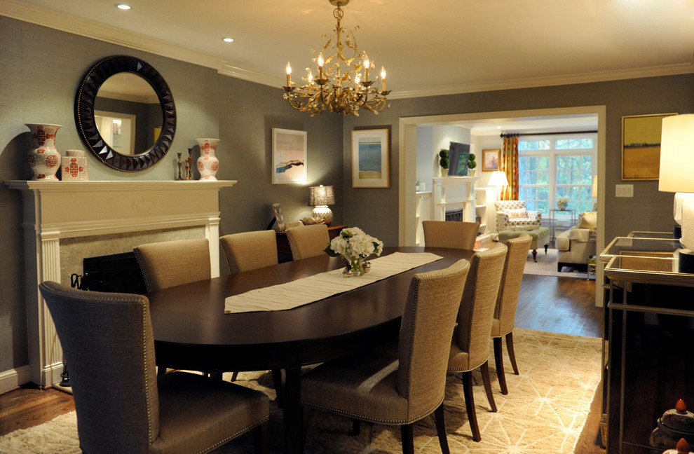 Photo of a mid-sized traditional separate dining room in DC Metro with grey walls, dark hardwood floors and a standard fireplace.