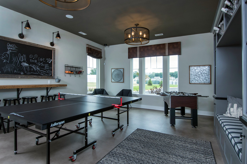 Inspiration for a traditional family room in Columbus with a game room, grey walls and grey floor.