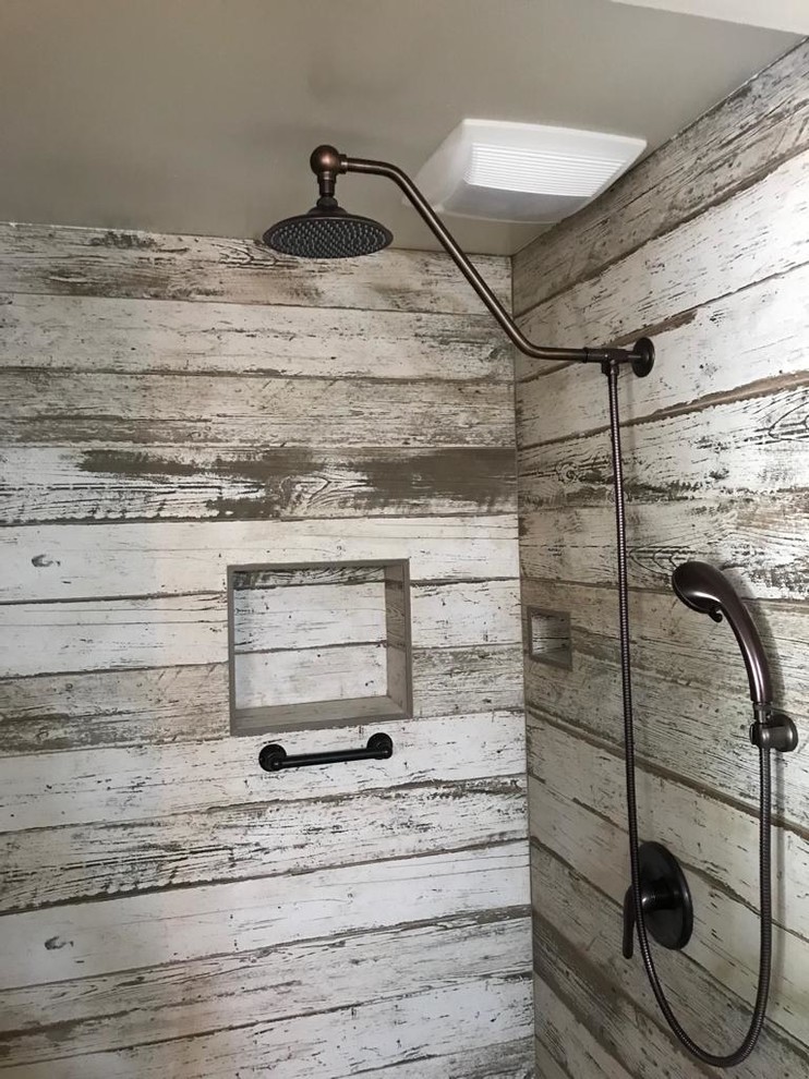 This is an example of a mid-sized country master bathroom in San Francisco with louvered cabinets, distressed cabinets, an open shower, a one-piece toilet, white walls, an integrated sink, wood benchtops, white floor, an open shower, yellow benchtops, multi-coloured tile and concrete floors.