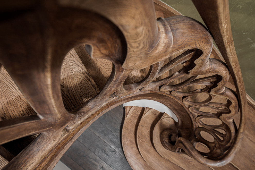 Photo of an expansive eclectic painted wood curved wood railing staircase in Berlin with painted wood risers.