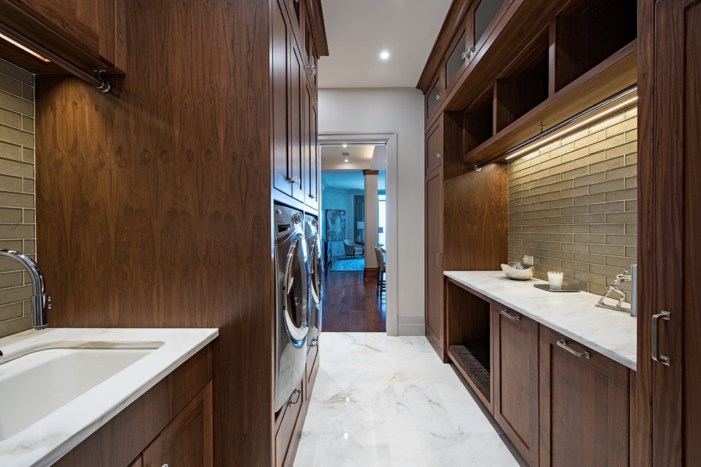Design ideas for a transitional galley utility room in Tampa with an undermount sink, shaker cabinets, dark wood cabinets, marble floors, a side-by-side washer and dryer, white floor and white walls.