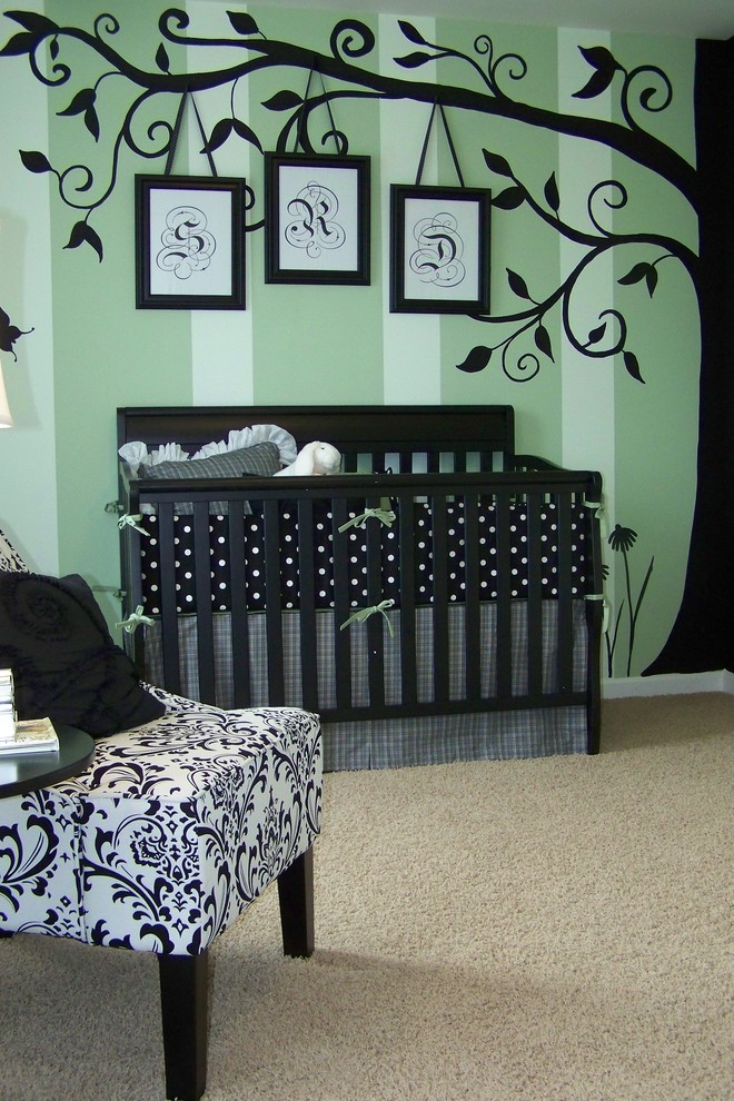 Photo of a traditional nursery in Nashville with green walls.