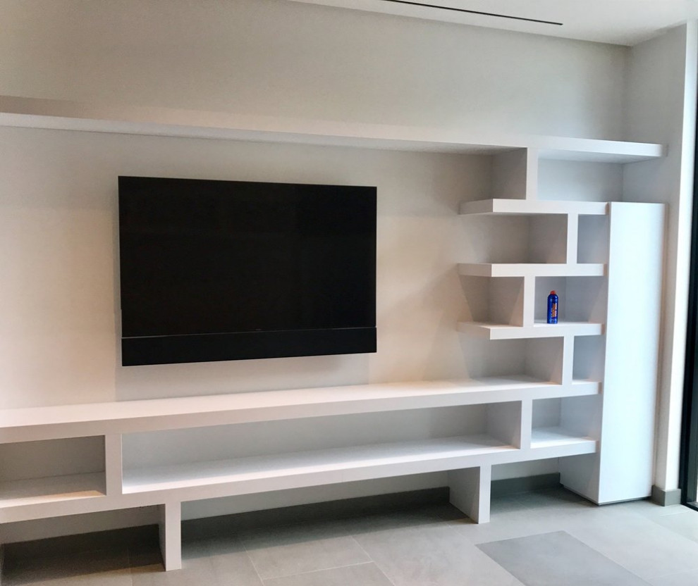 Minimalist living room photo with a media wall