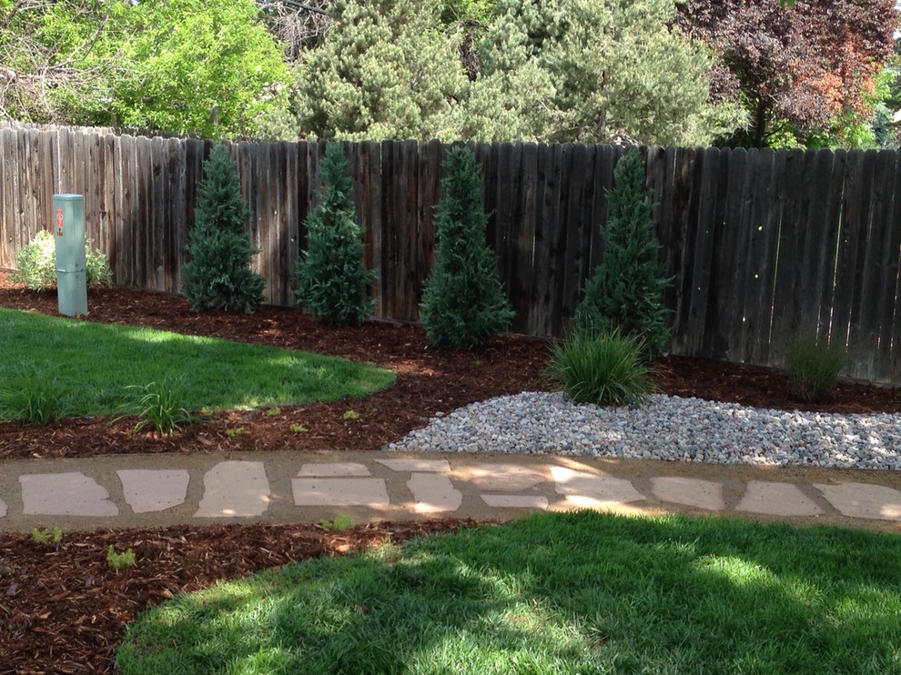 Design ideas for a mid-sized backyard stone landscaping in Denver.