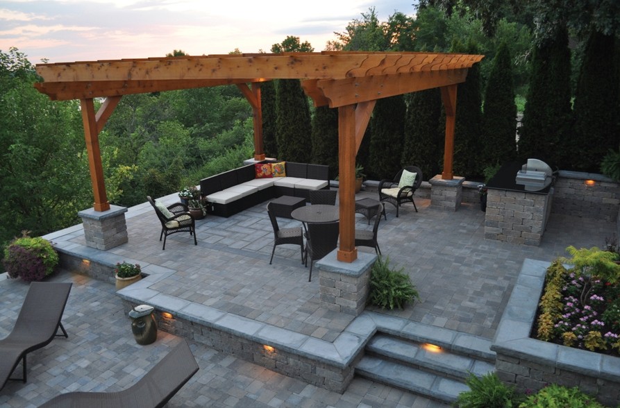Photo of a traditional backyard patio in Philadelphia with an outdoor kitchen and a pergola.