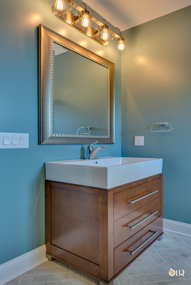 Transitional 3/4 bathroom photo with flat-panel cabinets, light wood cabinets and blue walls