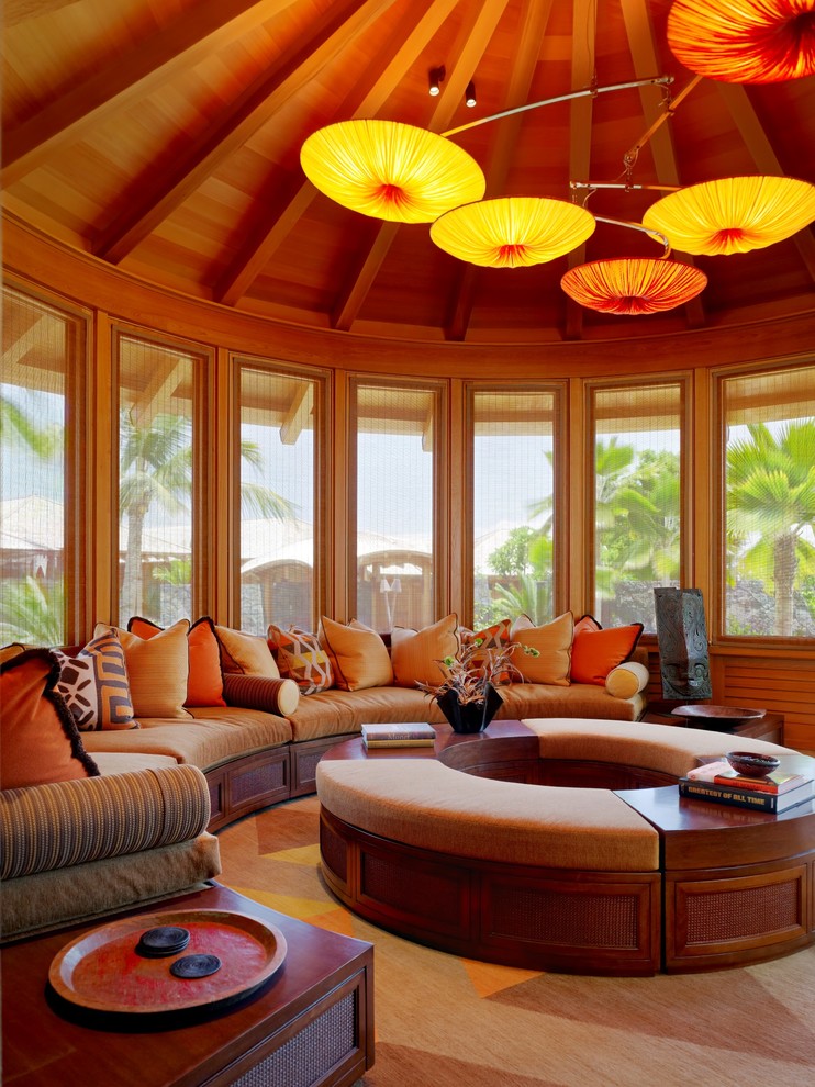 This is an example of a tropical sunroom in Hawaii with carpet and multi-coloured floor.