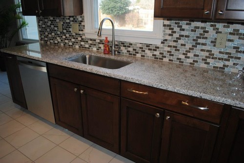 Luna Pearl COutnertops With Dark Brown Cabinets