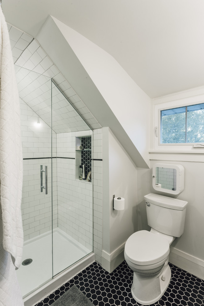Design ideas for a small contemporary bathroom in Minneapolis with furniture-like cabinets, white cabinets, an alcove shower, a two-piece toilet, black and white tile, porcelain tile, grey walls, porcelain floors and a wall-mount sink.