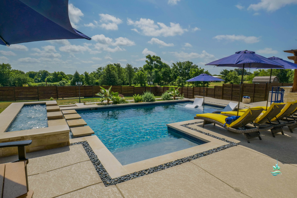 Huge tuscan backyard custom-shaped infinity pool landscaping photo in Dallas with decking